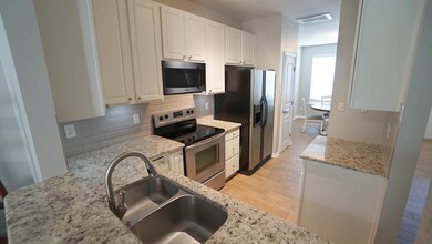 *Kitchen w/ a View into Living Area*