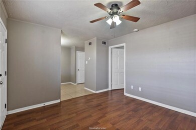 Empty room featuring a textured ceiling, ornamenta