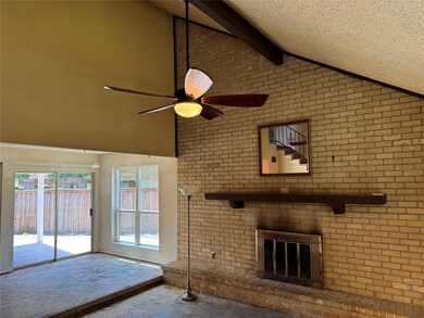 Unfurnished living room with ceiling fan, lofted c