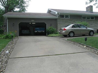 Exterior Front. 2 Car Garage with extra parking pa