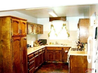 Lots of cupboards, including pantry.  Dish washer,