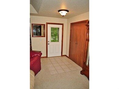 Other. Tiled interior entryway into home with beau