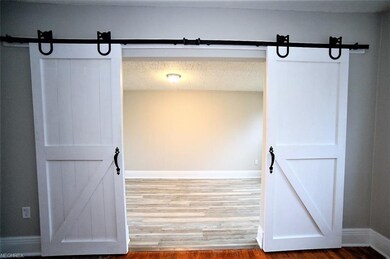 * 2 Barn Door Entry In Living Room Leads To An Off