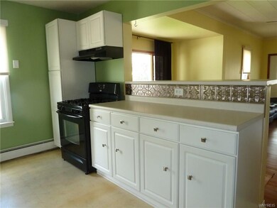 Kitchen is open to the living area with a pub height bar to accommodate all your kitchen needs.