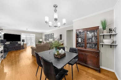 Dining room with ornamental molding, a notable cha