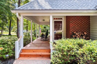 View of exterior entry with covered porch