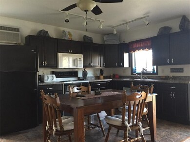 Modern kitchen/dining combo, over the sink window 