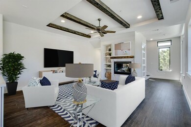African Marble Gas Fireplace and Beautiful Beams Define this Entertaining Area.