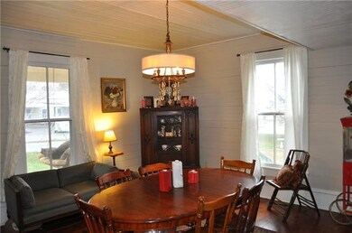 Beautiful dining room with hardwoods and a firepla