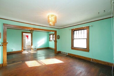 The oak flooring continues into the kitchen.