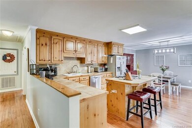 Open Concept into the kitchen.  Bar Stools for eas