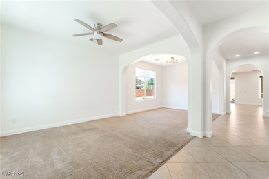 Unfurnished room featuring a ceiling fan, light co