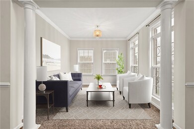 Formal Living room with floor to ceiling windows &