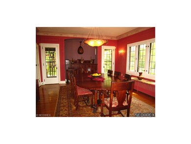 Formal dining room with leaded windows, hardwood f