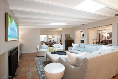 Living room featuring dark tile patterned flooring