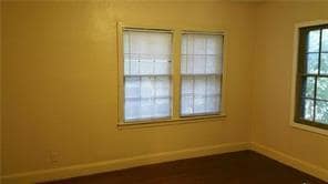 Unfurnished room featuring baseboards