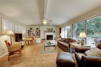Living Room with Window Wall and Wood Burning Fire