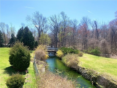 Listen to the babbling Woonasqutucket River from t