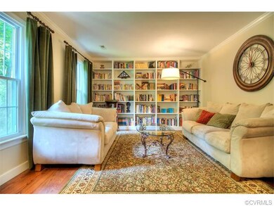 Formal living room has an awesome built-in bookshe