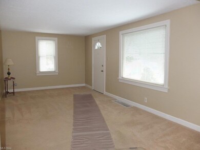 Living room with new carpet.