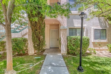 Entrance to property featuring stucco siding and a