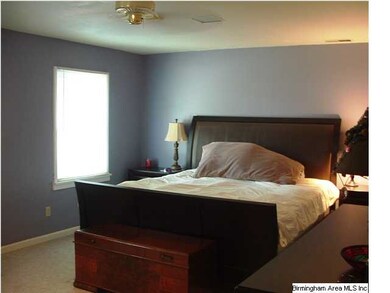 Large Master bedroom with two windows and private 
