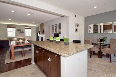 View from kitchen looking into dining area & great