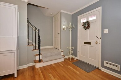 Welcoming entry beautifully painted and refinished