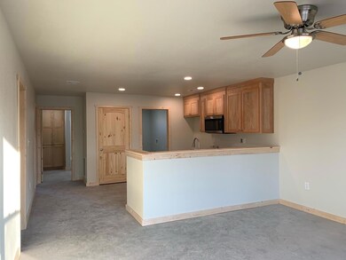 Kitchen featuring recessed lighting, a ceiling fan