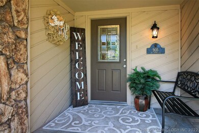 View of front door and porch area.
