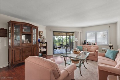 Living area featuring wood finished floors and bas