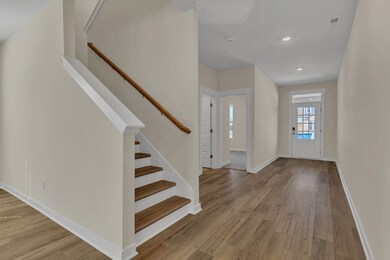 Entry Foyer with view of guest room or office and full bathroom