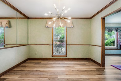 Unfurnished dining area featuring an inviting chan