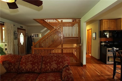 Beautiful open stairway to upper and lower levels.