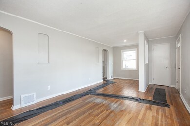 Unfurnished bedroom with hardwood / wood-style floors