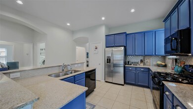 Look at the space & convenience offered in this incredible open kitchen! The whole-home water filtration system added by the sellers will be included in the sale.  It's an upgraded system including seven filters that provides bottled water-quality water for the entire home!