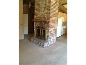 Living Room. Brick Fireplace Creates A Cozy Feelin