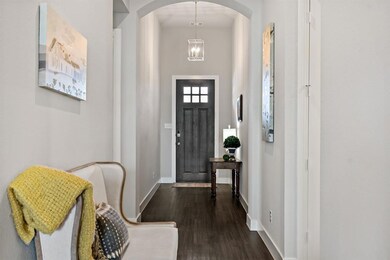 Entry with soaring eleven foot ceiling.