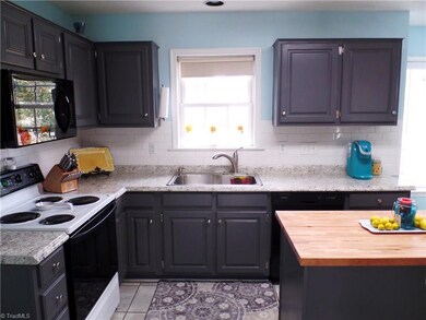 Updates include new microwave and dishwasher, along with extra large sink.