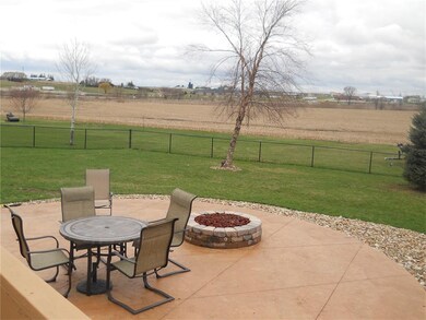 The circular patio features a gas fed fire ring fo