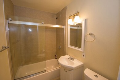 Remodeled bathroom with floors, ceramic shower, an