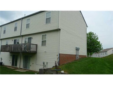 Exterior Back. Back view of the end unit townhome