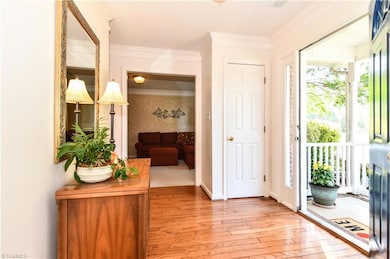 Bright Foyer with hardwood floors and 2 closets.