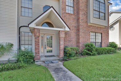 Entrance to property featuring a lawn