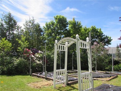 Raised bed gardens and mature plantings