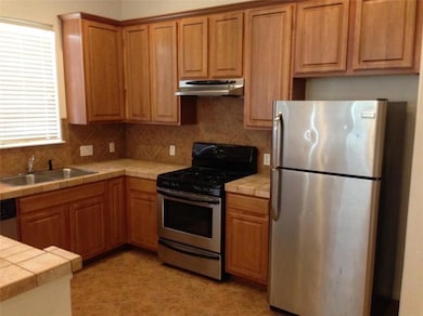Kitchen with stainless steel appliances, under ca