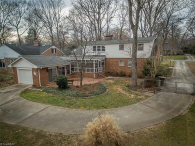 Fenced backyard, level driveway perfect for basketball, one car garage or game room with sliding doors. Screened porch, patio.  Brick and vinyl.