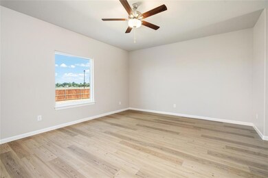 Bright and inviting, this spacious living room is 