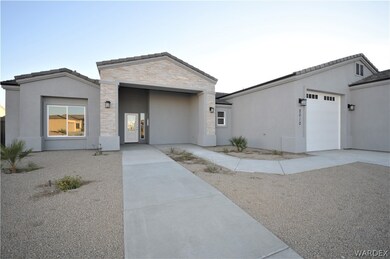 Covered fron patio/Entry, concrete walkway to stre