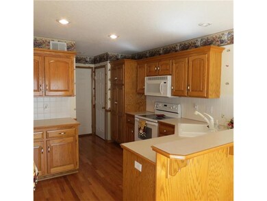 Spacious Kitchen with all appliances. Corner sink,